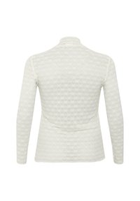Długi rękaw w kolorze off-white z teksturowanym heksagonalnym wzorem, z wysokim dekoltem i dopasowanym krojem. Miękka, lekka tkanina.