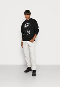 Rethink Stat UNISEX - Camisola - black