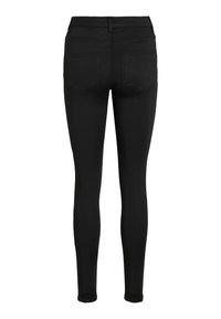 Jean skinny noir vu de dos avec deux poches plaquées, passants de ceinture et une coupe ajustée taille haute.