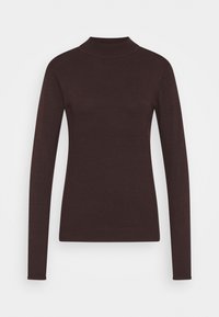 Tummanruskea pitkähihaisen istuva neule, jossa on puolikorkea kaulus, valmistettu hienosta neuletikankaasta vaaleaa taustaa vasten.