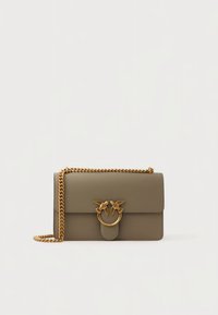Olive green leather handbag with a gold chain strap. Features a flap closure adorned with two bird accents and a circular clasp.