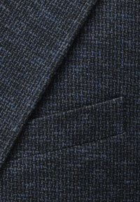 Navy blue textured fabric with a subtle pattern, featuring a tailored pocket. Material has a fine weave, offering a sophisticated look.