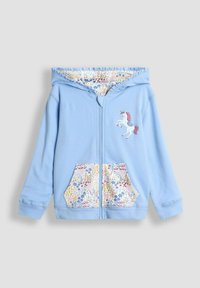Sudadera azul claro con cremallera frontal, que presenta un diseño de unicornio bordado y bolsillos estampados con motivos florales y de unicornio.