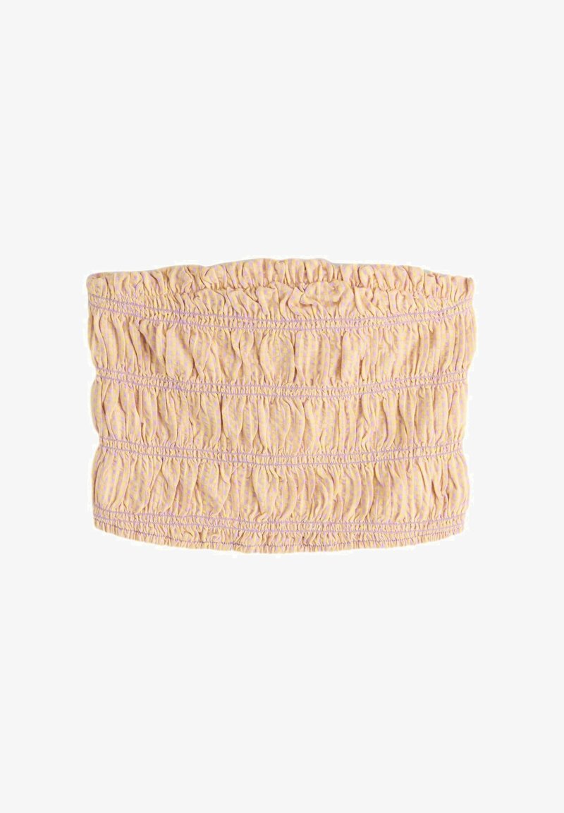 Haut bandeau rose pâle froncé avec fronces élastiques et motif à petits points subtils, en plan à plat sur fond blanc.