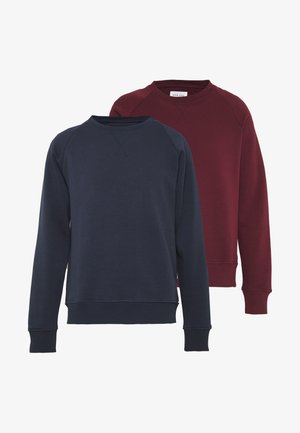 Két kerek nyakú pulóver, az egyik tengerészkék, a másik bordó, bordázott mandzsettákkal és aljjal, egyszínű és puha tapintású.