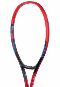 Red and black tennis racket with a curved, aerodynamic shape. Features a blue accent, textured grips, and multiple grommet holes for strings.