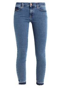 Blå skinny denimjeans med knäppning och dragkedja, fram- och bakfickor samt slitna kanter.