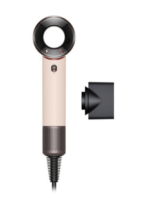 Moderne bladløs hårtørrer med en cylindrisk rosaguld krop, rund luftstrømsdyse, tænd/sluk-knap og en separat sort koncentratormundstykke.