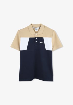 Camisa polo en colores beige, blanco y marino, con un cuello acanalado, tres botones y un logo en el pecho. Fabricada con tejido texturizado.