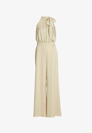 Tuta beige concollo alto e dettaglio a fiocco, caratterizzato da gambe ampie e morbide e una vita sagomata. Tessuto morbido.