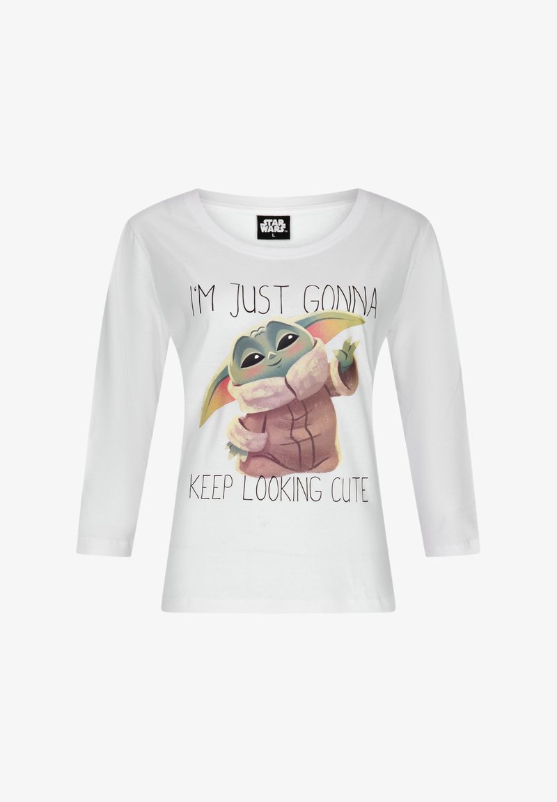 Witte longsleeve t-shirt met een grafisch ontwerp van een karakter met grote oren, tekst die zegt "IK GA SIMPELWEG VOORTDOEN MET ER CUTE UIT ZIEN," en een zachte katoenstructuur.
