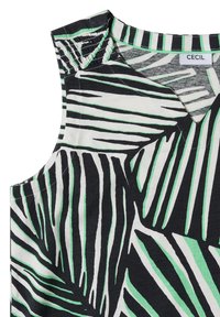 Blouse sans manches avec col en V, présentant des motifs abstraits de feuilles noir et blanc avec de fines touches vertes, en tissu doux.