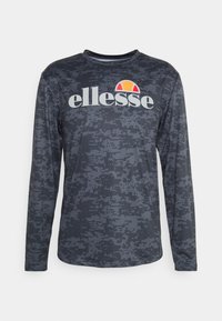 Pitkähihainen t-paita tummanharmaana, jossa on pikselimäinen kuvio. Varustettu pyöriöllä kauluksella ja valkoisella sekä oranssilla "ellesse"-logolla.