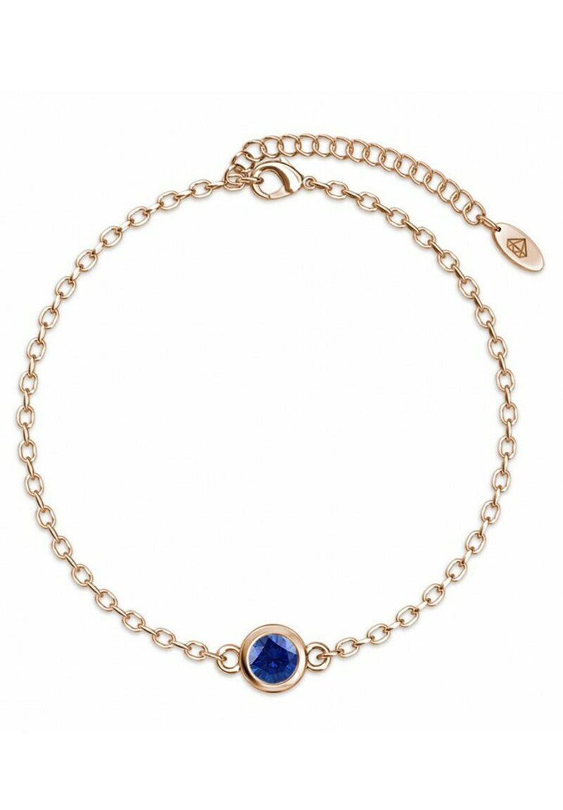 Bracciale a catena dorata con un centrale gemma blu rotonda, dal design a maglia delicata e chiusura regolabile per una vestibilità perfetta.