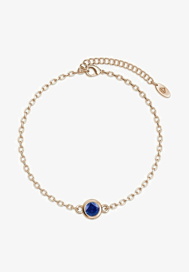 Bracciale a catena dorata con un centrale gemma blu rotonda, dal design a maglia delicata e chiusura regolabile per una vestibilità perfetta.