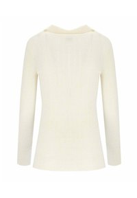 Maglietta a maniche lunghe a coste in morbido crema, con un sottile scollo a V e superficie strutturata. Il design è aderente con una silhouette snella.