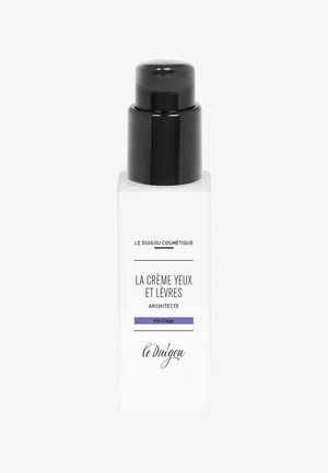 Weiße Flasche mit einer schwarzen Pumpe, mit dem Text "LA CRÈME YEUX ET LÈVRES ARCHITECTE" und einer lila Akzentlinie am Boden.
