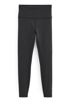 Fekete leggings magas derékkal. Simogatós, rugalmas anyagból készült, kontrasztos varrással és karcsúsított szabással.