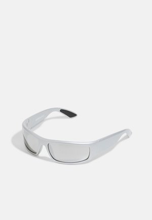 Silver sunglasses with a sleek, wraparound design. Clear lenses and textured black accents on the arms. Lightweight plastic material.