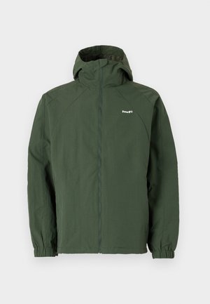Green hooded jacket made of lightweight fabric. Features elastic cuffs and a zip closure, with a logo on the left chest.