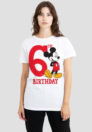 White cotton t-shirt featuring a large red "6TH" and "BIRTHDAY" text, with a graphic of Mickey Mouse in red shorts and yellow shoes.