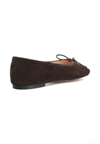 Brown suede flat shoes with a rounded toe, decorative bow, and a low black rubber heel. Smooth interior lining and clean stitching details.