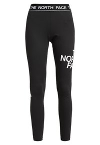 Mustat legginssit, jotka on valmistettu venyvästä kankaasta. Niissä on leveä vyötärö, jossa on valkoinen "THE NORTH FACE" -logo, sekä lisäbrändäystä vasemmassa jalassa.