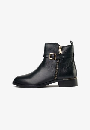 Black leather ankle boot with a rounded toe, featuring a side zipper, decorative buckle, and embossed crocodile pattern on the heel.