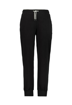 Pantalones de chándal negros hechos de tejido suave, con una cintura elástica y cordón blanco, puños en los tobillos ajustados y un detalle de marca mínimo.