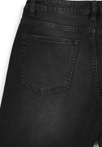 Black denim jeans featuring a back pocket with double stitching and a slightly faded texture, set against a white background.