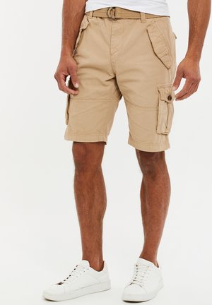 Shorts cargo kaki en mélange de coton, avec plusieurs poches, des détails cousus, une taille ajustable et une coupe décontractée.