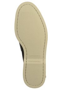 Schuhsohle aus einem glatten, beigen Gummi-Material mit strukturierten Oberflächen, eingeprägtem Markennamen und einem nicht abfärbenden Design.