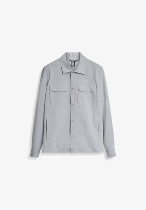 Hellgraue Jacke aus strukturiertem Stoff, mit Kragen, vorderem Knopfverschluss und zwei Brusttaschen. Lange Ärmel ohne Muster.