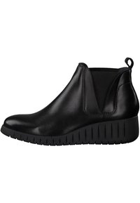 Schwarze Lederstiefeletten mit elastischen Seiteneinsätzen und Ziehlasche. Robuste schwarze Laufsohle mit gerippter Textur. Elegantes, rundes Zehendesign.