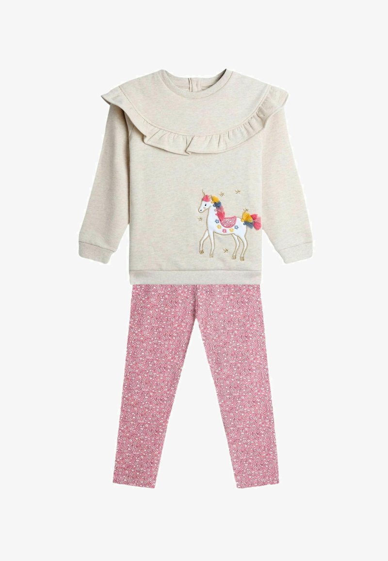 Svetlo béžová mikina s volánovým golierom a grafikom jednorožca; ružové kvetinové legíny. Mäkká tkanina s podrobnou výšivkou a jasnými farbami.