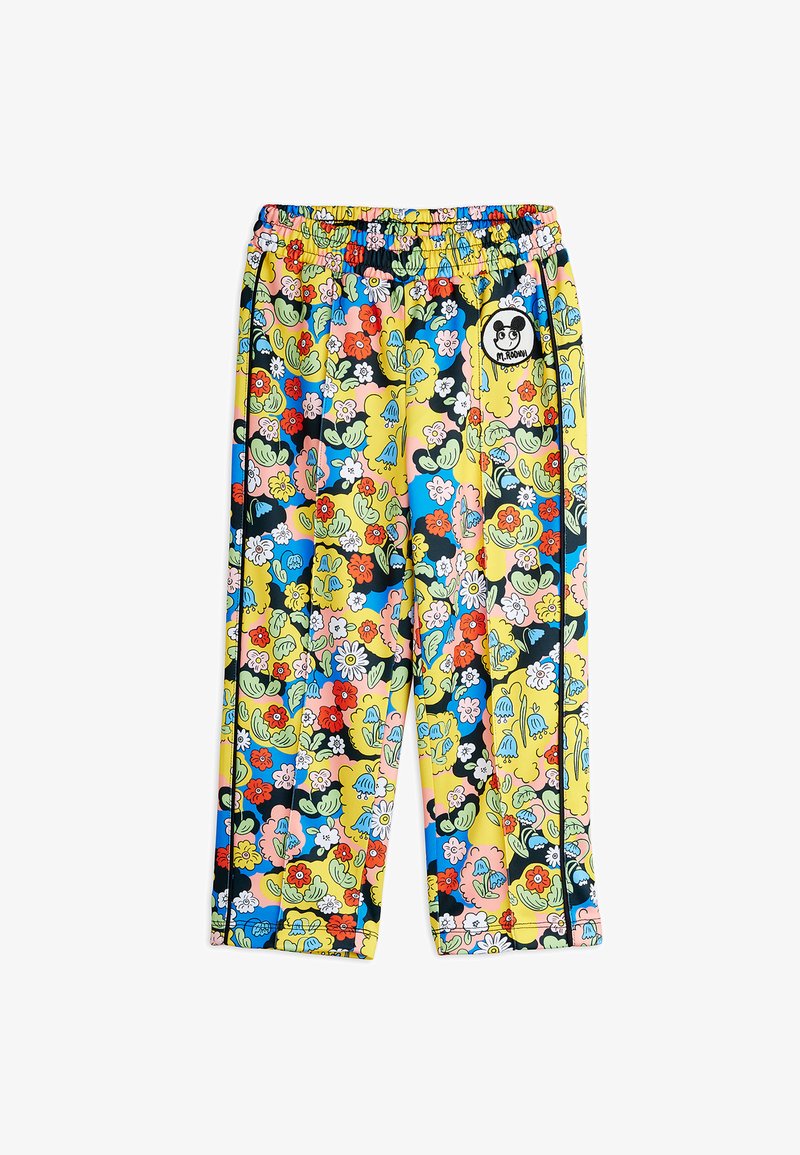 Kids' elastic-waist pants with colorful floral pattern in yellow, blue, red, pink, and green, featuring a small patch with a cartoon face.