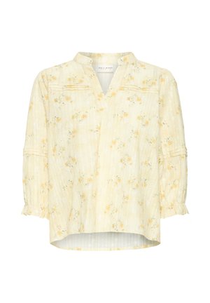 Blouse fleurie jaune clair avec des manches bouffantes 3/4, un col mandarin et une texture subtile à rayures verticales.