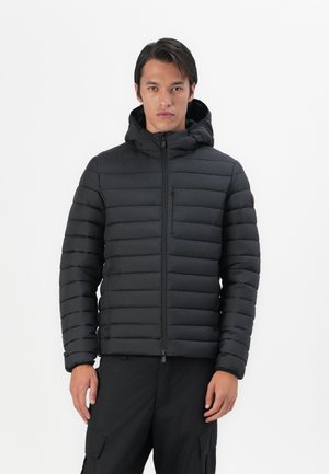 Black puffer jacket with quilted design, hood, front zipper, and a small zippered pocket. Textured fabric and elastic cuffs.