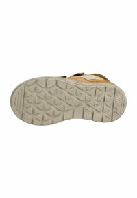 Suela de zapato de goma con un patrón texturizado en zigzag. Predominantemente gris con acentos en marrón claro a lo largo de los lados. Durable y diseñada para ofrecer tracción.