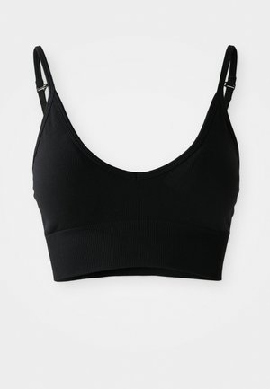 Must mustriba with ümmarguse kaelusega, soonilise tekstuuriga, reguleeritavate rihmadega ja laia elastse äärisega all. Ilma padjata või toestustraatideeta.