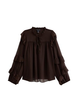 Blusa marrone con maniche a volant, scollo rotondo con dettaglio a fiocco e vestibilità morbida. Realizzata in tessuto leggero con una consistenza liscia.