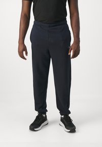 Champion ICONS ELASTIC CUFF PANTS LOOSE FIT - Tepláky - dark blue