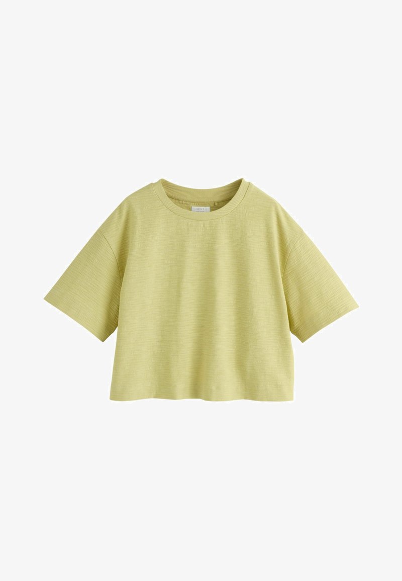 Haut court vert clair à manches courtes, col rond, en tissu texturé avec une coupe décontractée.