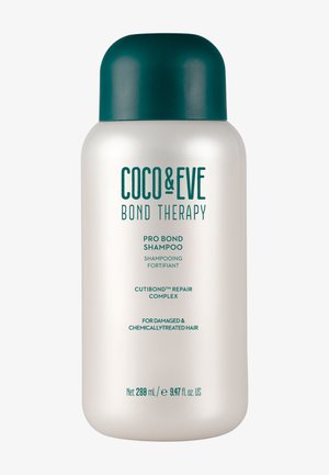 Coco & Eve Bond Therapy Pro Bond Shampoo, 280 mL. Flacone di plastica con tappo turchese, superficie liscia color avorio e testo verde che descrive le proprietà riparatrici.