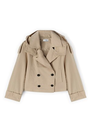 Trench-coat beige court avec boutons noirs doubles sur le devant, larges revers, épaulettes aux épaules et sangles aux poignets sur les manches longues.