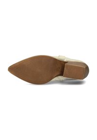 Beige shoe sole with a pointed shape, textured rubber for grip, and a brown block heel, featuring patterned ribbing for added traction.