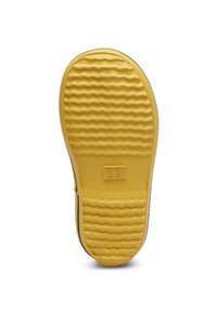 Gummisulor i gult med ett strukturerat vågigt mönster, med ett centralt nummer '23' och en slät kant för stabilitet.