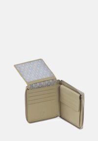 Beige leather wallet with a zip closure, five card slots, and a patterned ID window featuring light blue stars on a tan background.