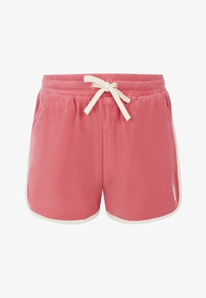 Schwarzes Kurzarmoberteil mit Rüschensleeves, kombiniert mit rosafarbenen Handtuchshorts mit elastischem Bund und Kordelzug, weißen Akzenten und Taschen.