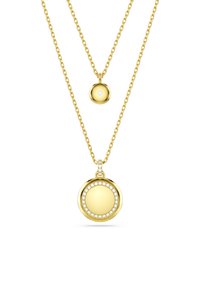 Kuldne kaelakee kahe kihiga kettidega. Alumine ripats on ümar, kaunistatud väikeste selgete gemmadega. Ülemine ripats on väiksem kullast pall.